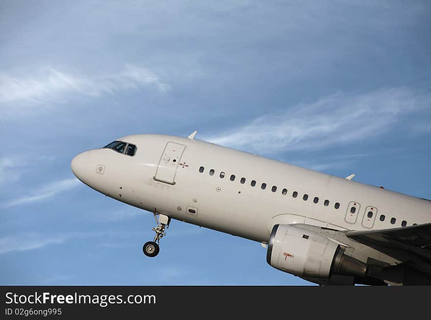 Airliner taking off in a blue sky