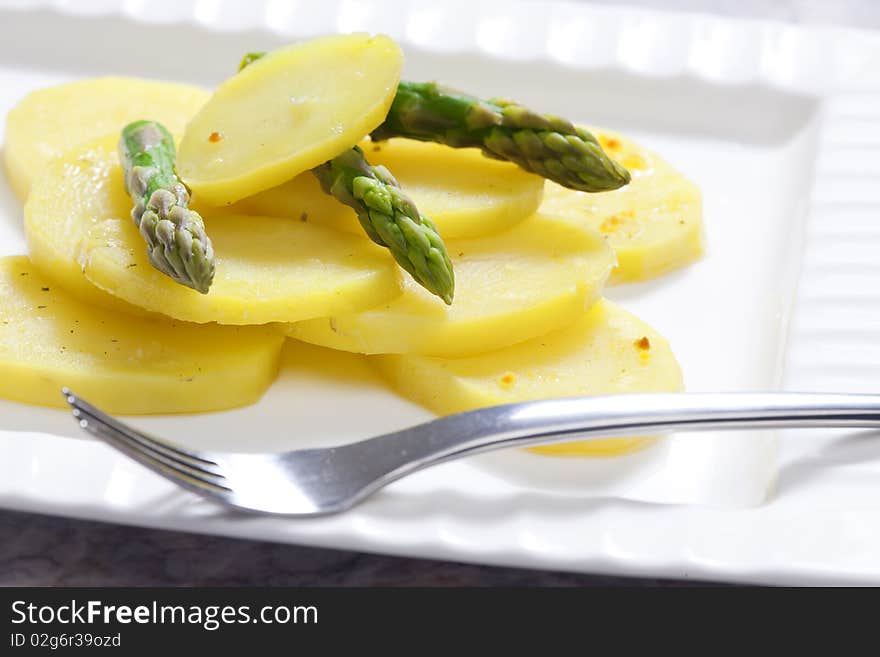 Cooked potatoes with green asparagus. Cooked potatoes with green asparagus