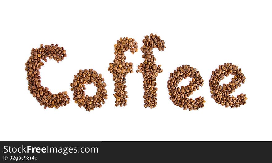 Inscription from coffee grains on a white background