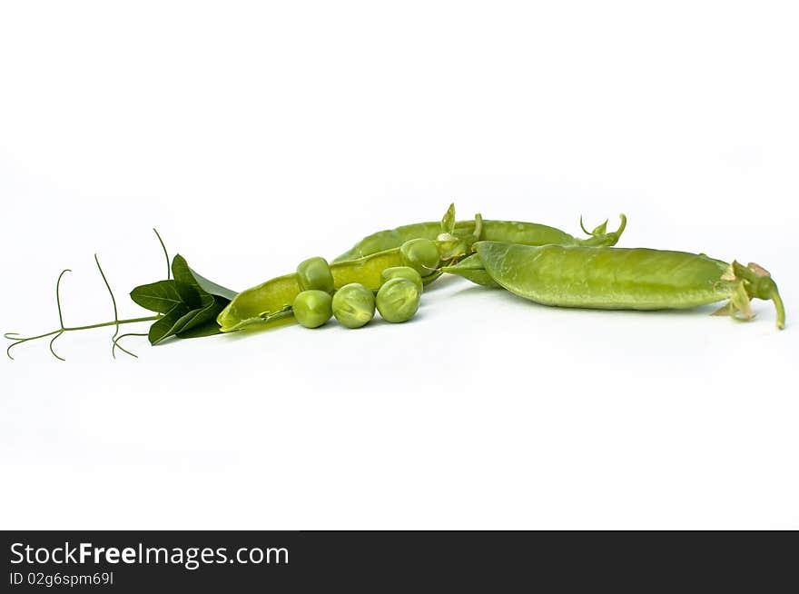 Fresh green pea in the pod with flowers isolated on white