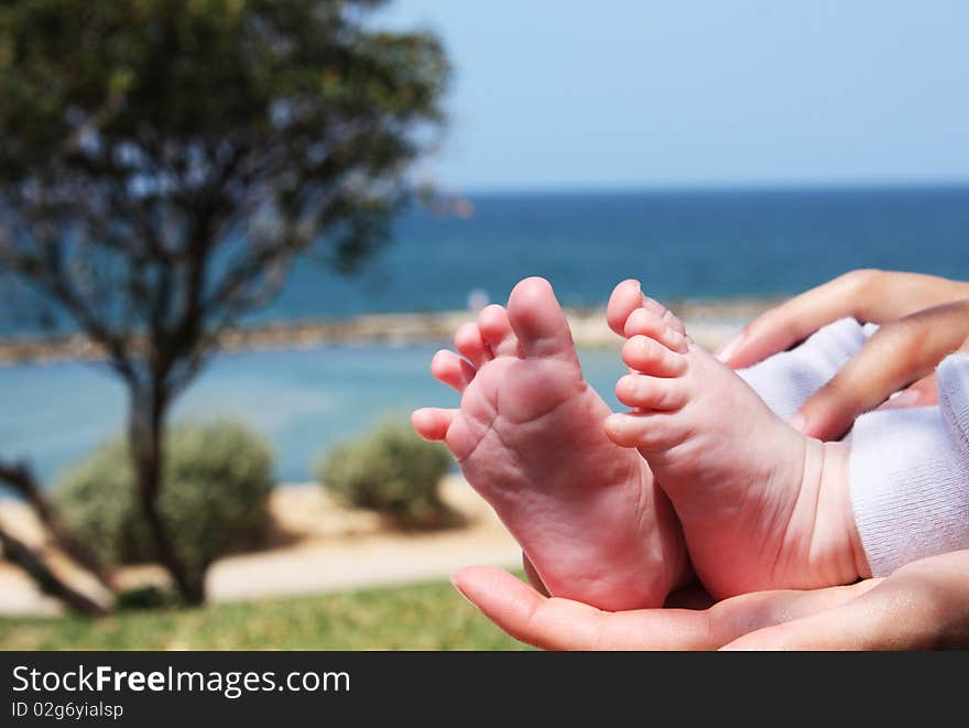 Little feet and big feet. Mother and son.