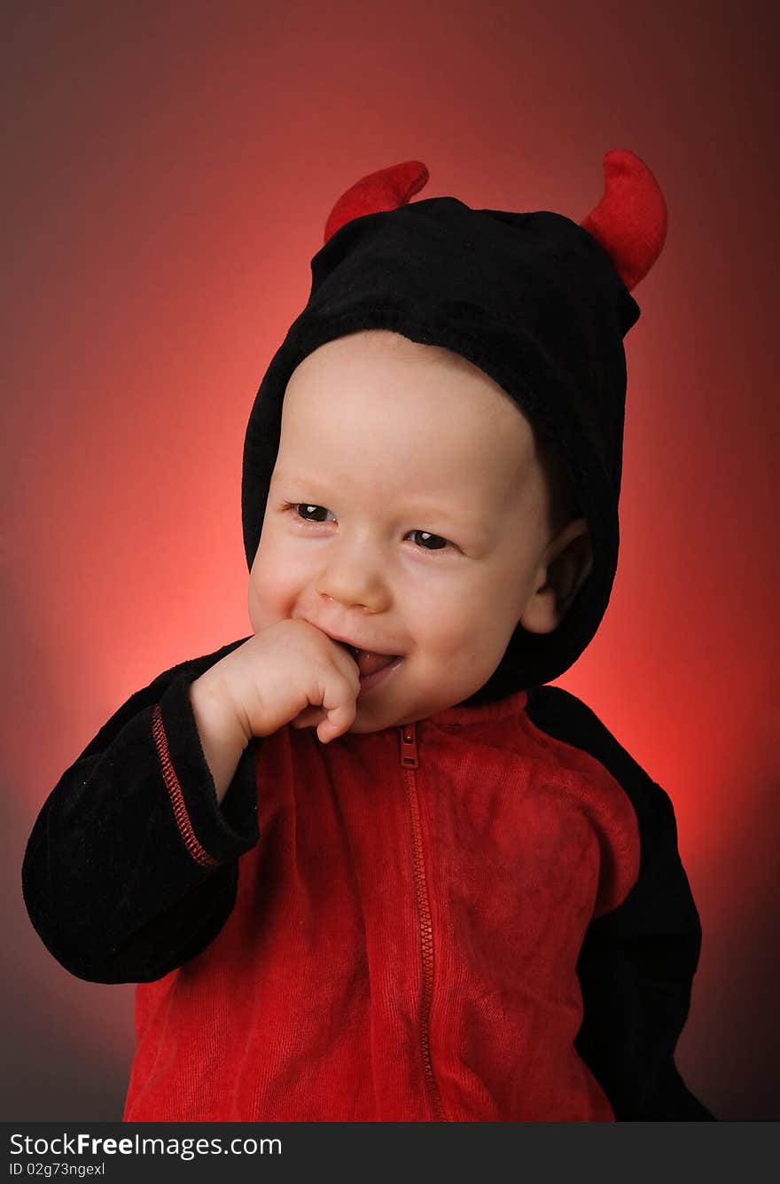 Cute child in costume Little devil