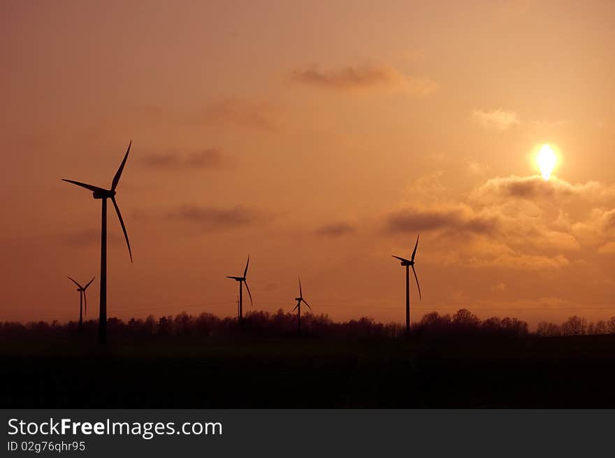 Windmill conceptual image. Windmills in sundown.