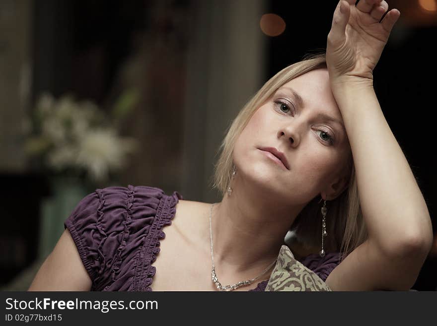 Woman leaning her head on her hand