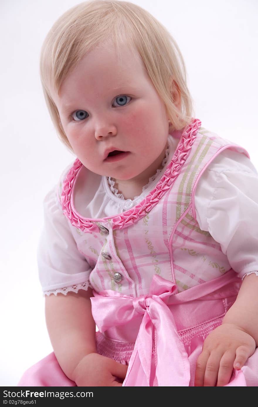 Blond girl in traditional dress on white background. Blond girl in traditional dress on white background