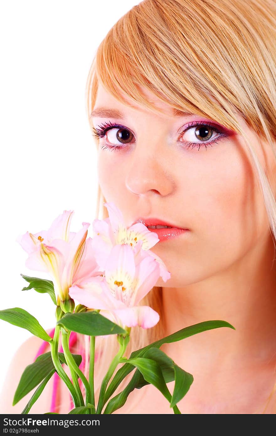 Portrait of a woman holding pink flowers over white background