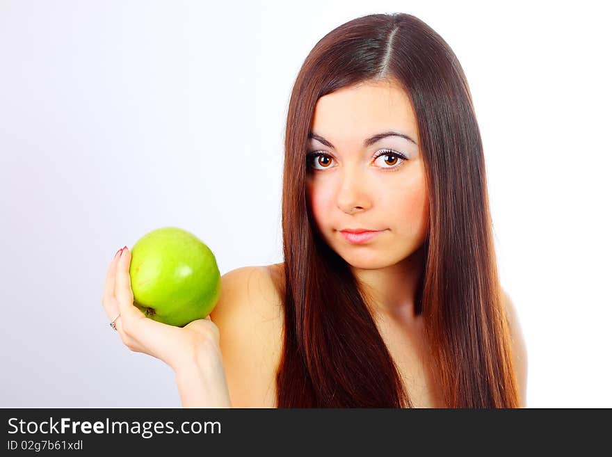 Young girl holding a green apple. Young girl holding a green apple