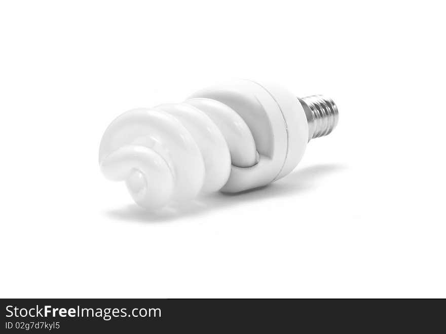 Single energy saving light bulb with white background. Single energy saving light bulb with white background.