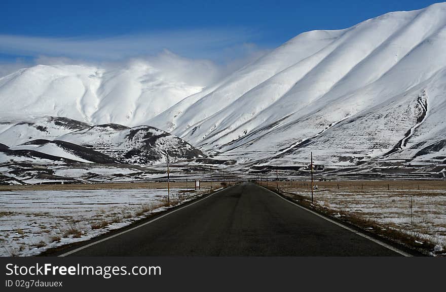 Mountain road panorama captured in Castelluccio di Norcia. Mountain road panorama captured in Castelluccio di Norcia