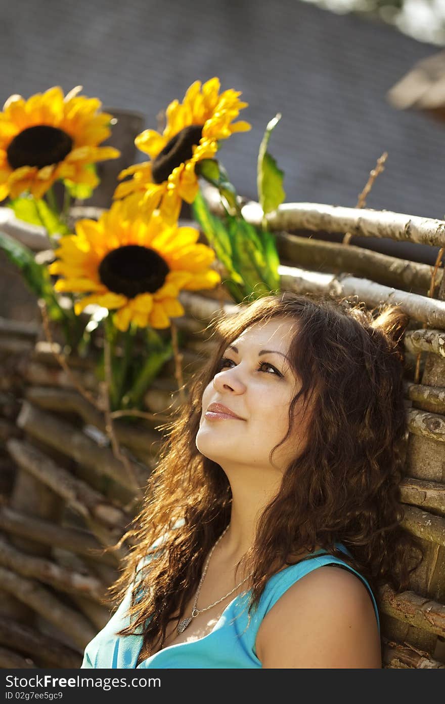 Girl in the countryside with sunflowers