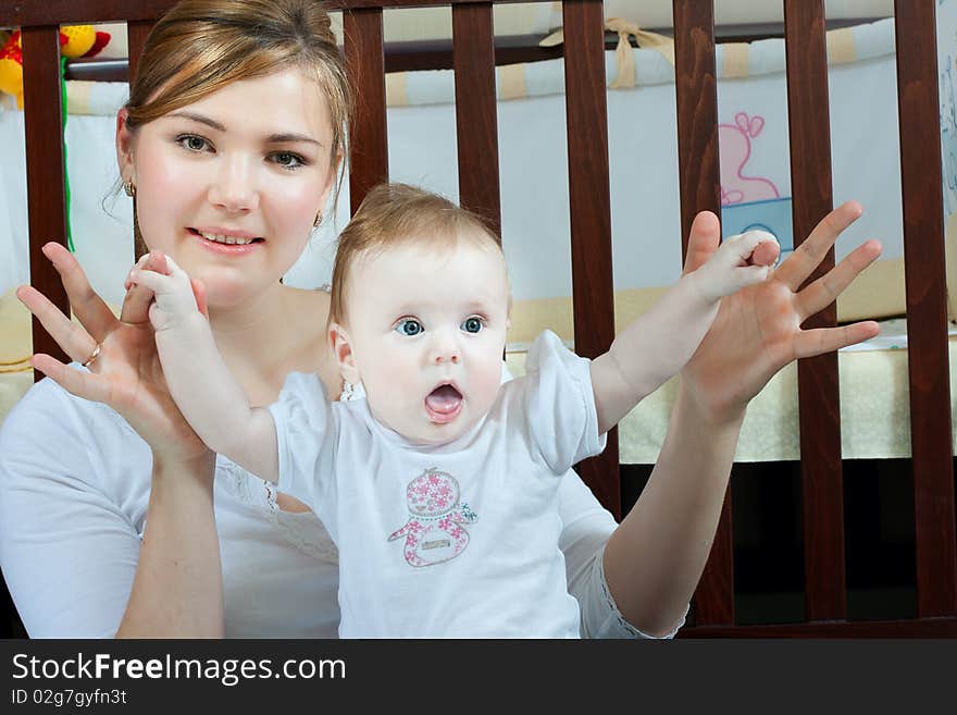 Young beautiful mother with litlle cute baby daughter. Young beautiful mother with litlle cute baby daughter