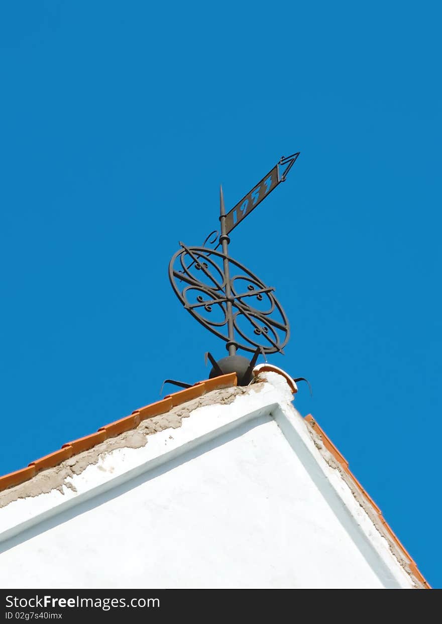 Architectural details a Wind-vane of ancient city. Architectural details a Wind-vane of ancient city