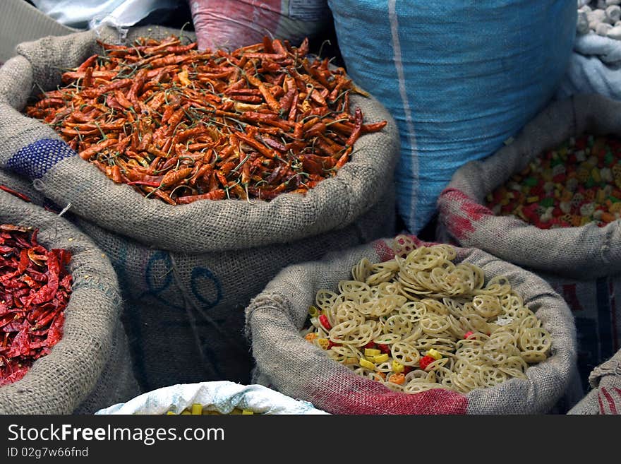 Indian red peppers and pasta in bags for sale on bazar. Indian red peppers and pasta in bags for sale on bazar.