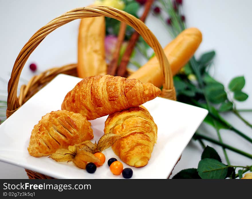 A bread image at the basket on the white background