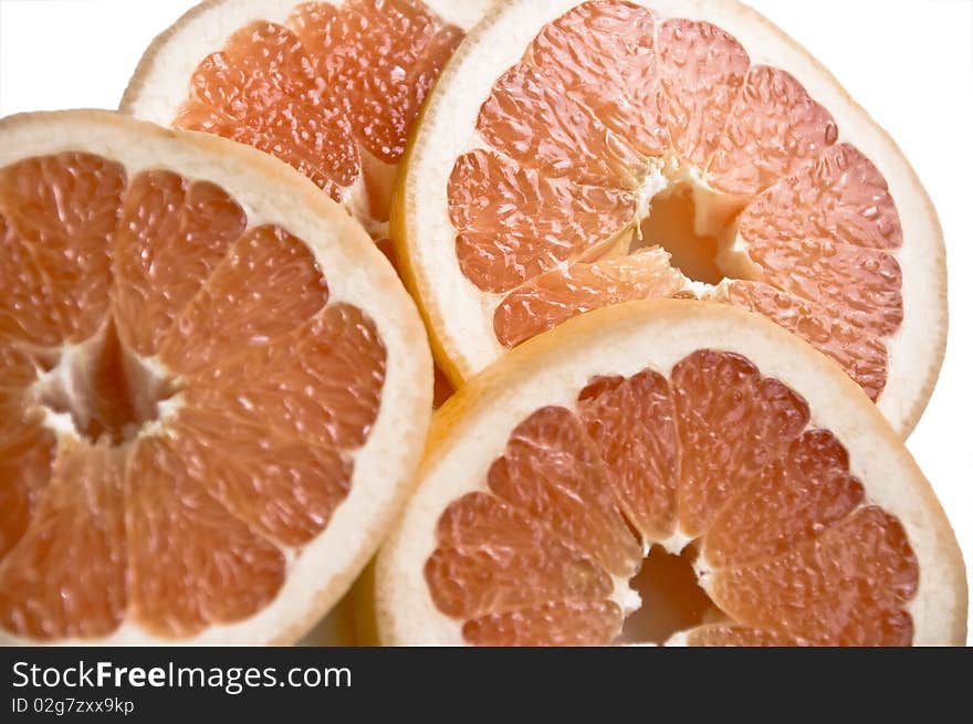 Cut slices of ripe, juicy fresh oranges. Isolation on white background.