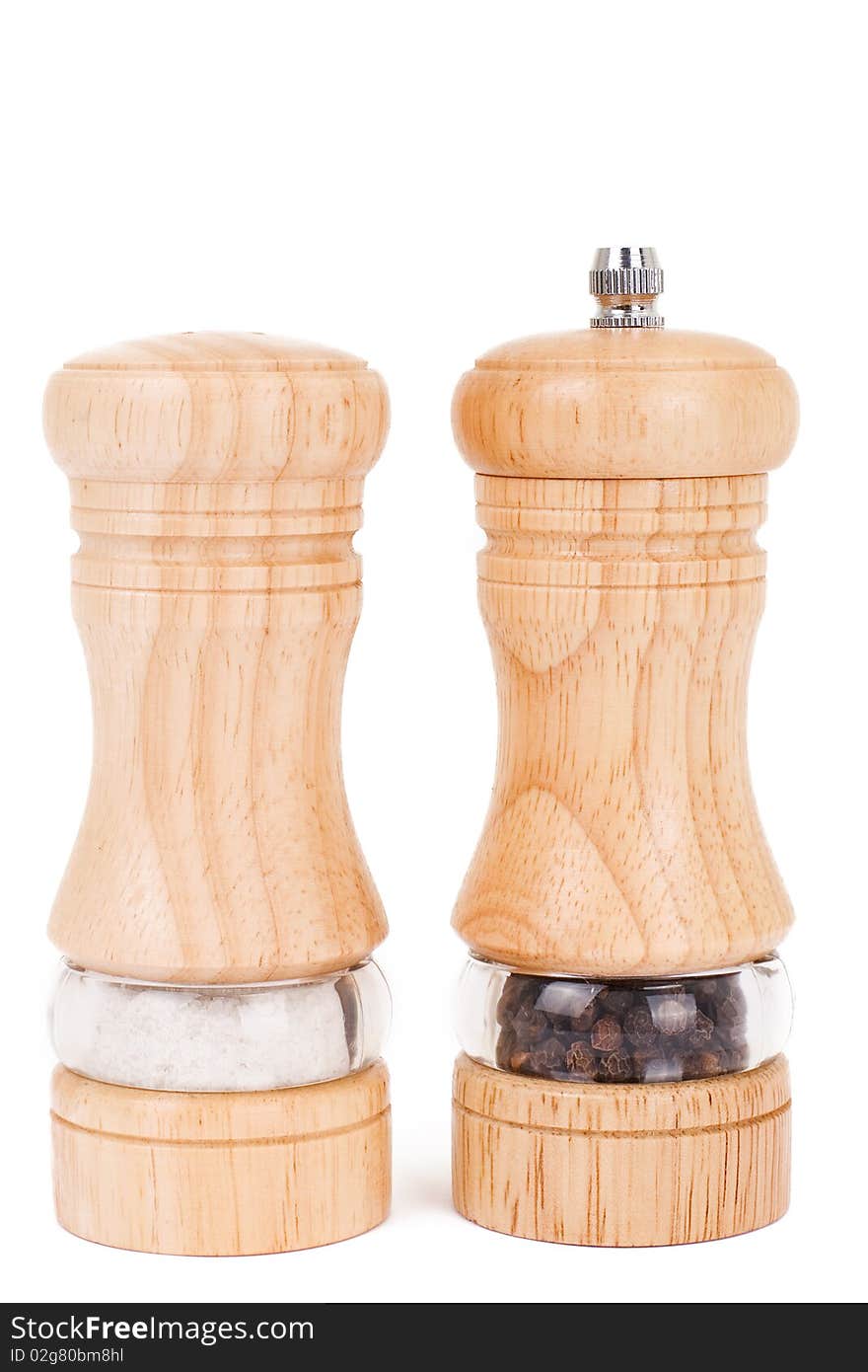 Wooden saltcellar and mill for pepper over white