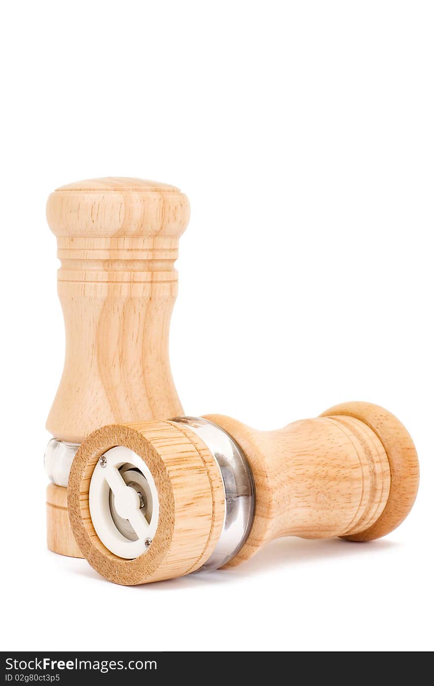 Wooden saltcellar and mill for pepper over white