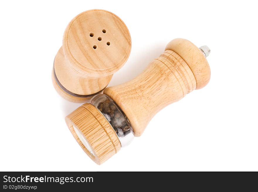 Wooden saltcellar and mill for pepper over white