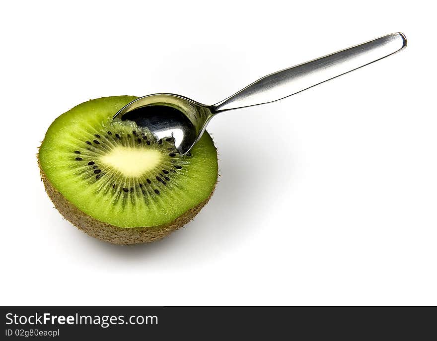 Kiwi tropical fruit and spoon isolated on white background. Kiwi tropical fruit and spoon isolated on white background