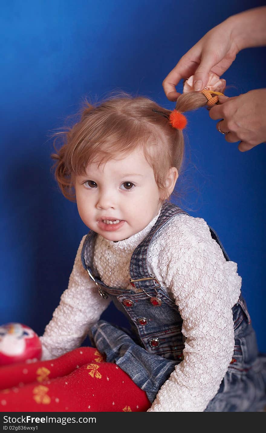 Which portrait of the girl is braided with hair. Which portrait of the girl is braided with hair