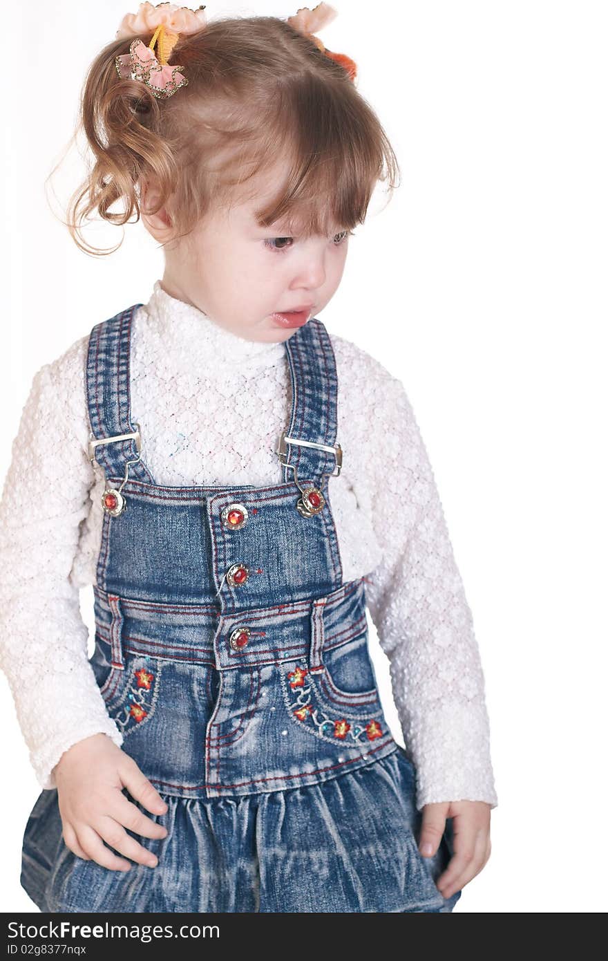 Portrait of the small beautiful girl on a white background. Portrait of the small beautiful girl on a white background