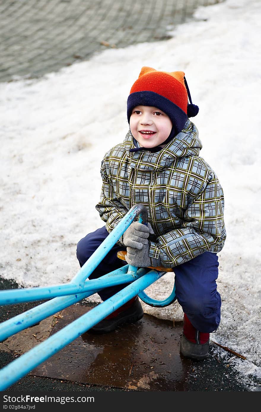 Boy on a walk in the swing