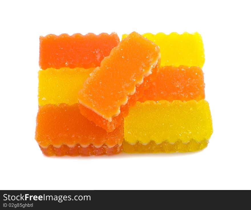 Yellow and orange fruit jelly on the white background