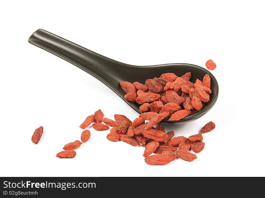 Goji Berries on a Black Spoon