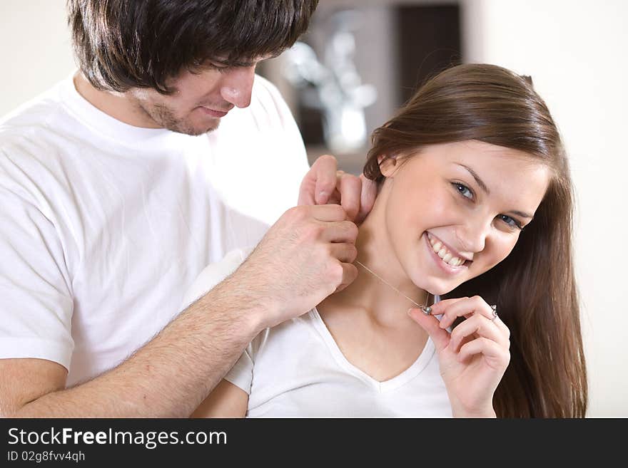 Boy and girl with smile and with chain. Boy and girl with smile and with chain