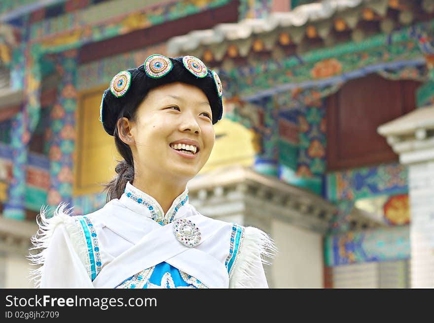 Pretty Chinese woman dressed in the traditional clothes of the Naxi minority culture. Pretty Chinese woman dressed in the traditional clothes of the Naxi minority culture