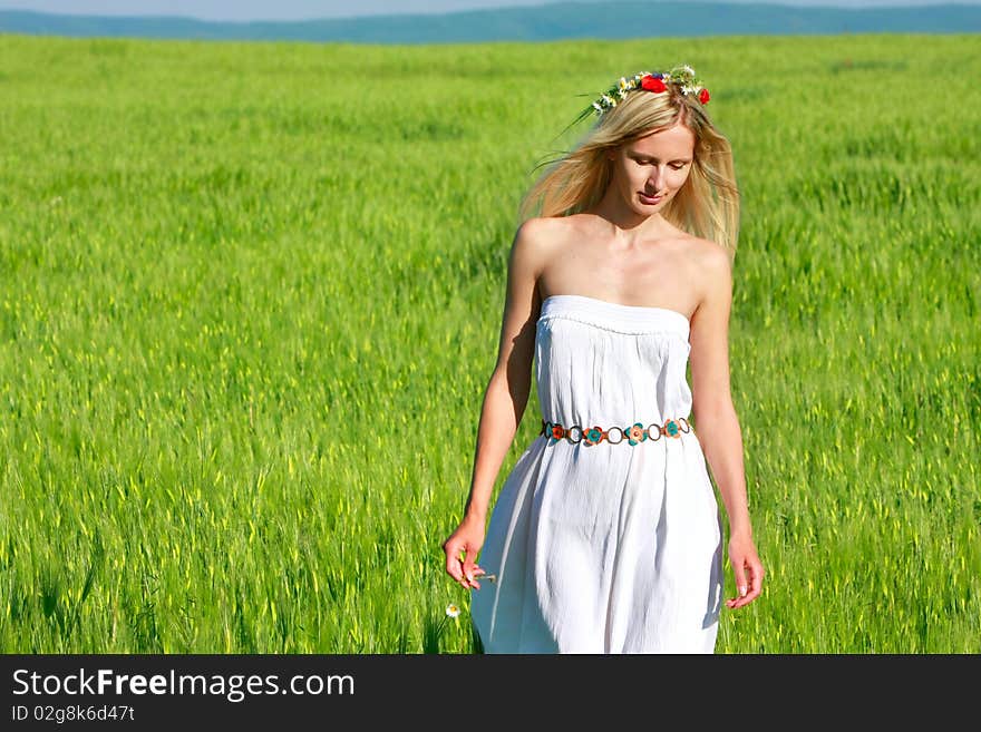 Young Beautiful Woman On Natural Background