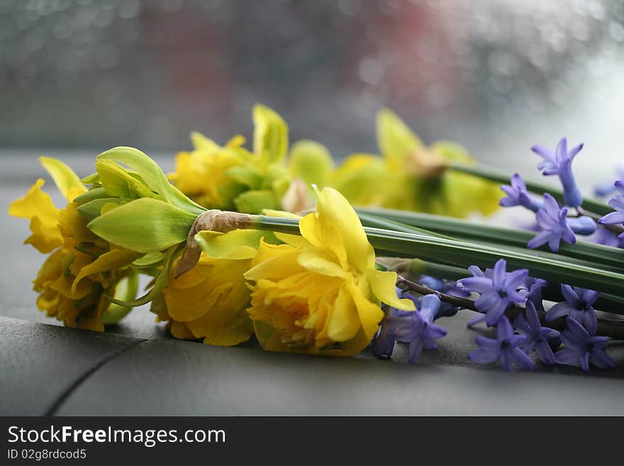 Flowers in the back of a car on a rainy day. Flowers in the back of a car on a rainy day