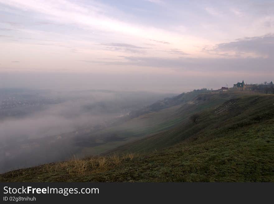 Mysterious fog over a river channel