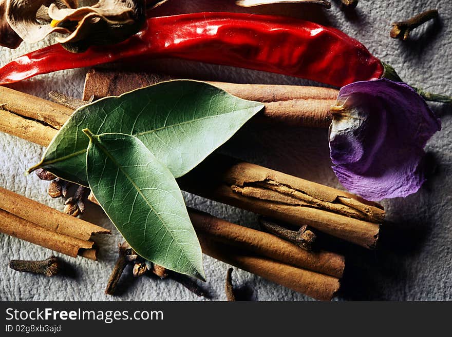 Still life of dried spices over leather