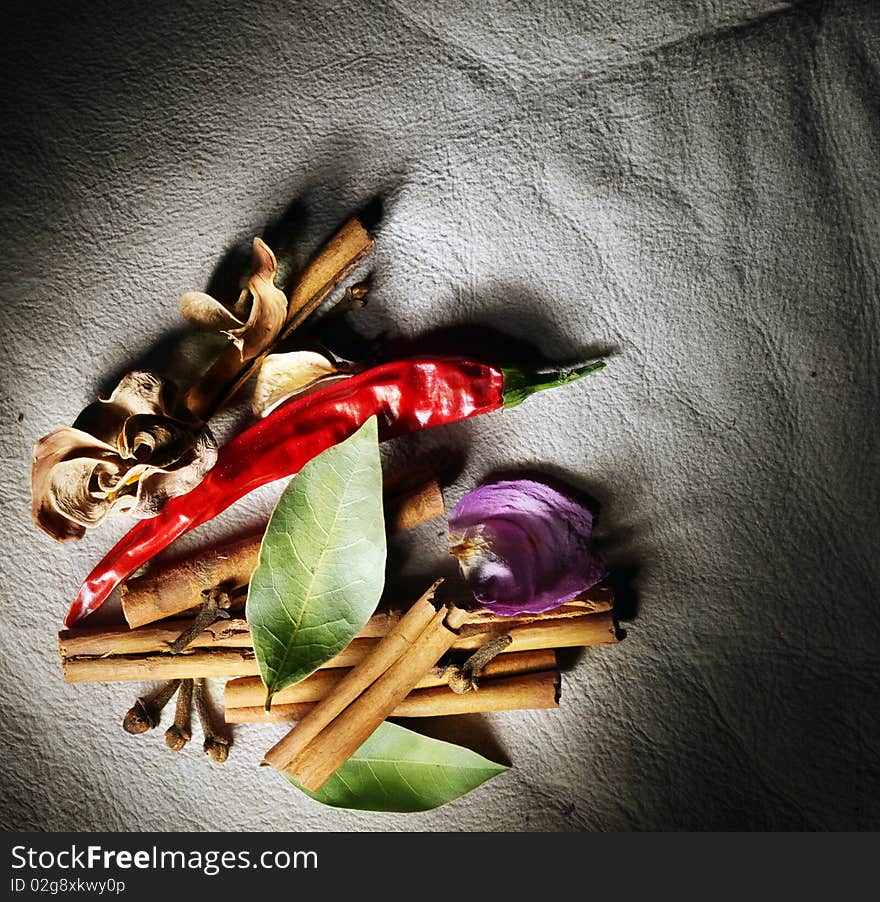 Still life of dried spices over leather