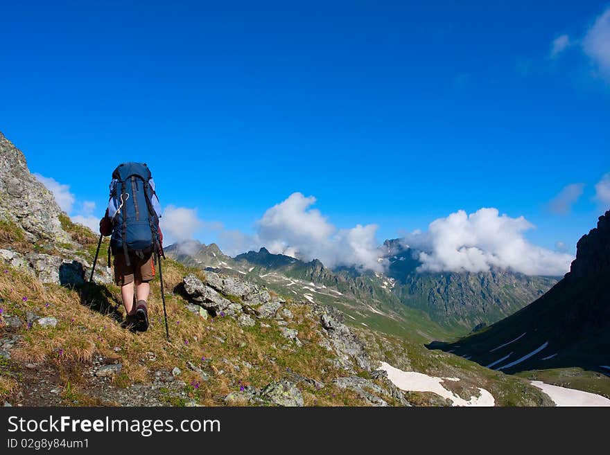 Hiker boy in Caucasus mountains