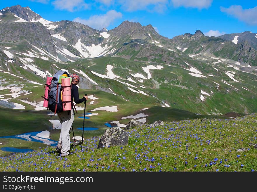 Hiker boy in Caucasus mountains