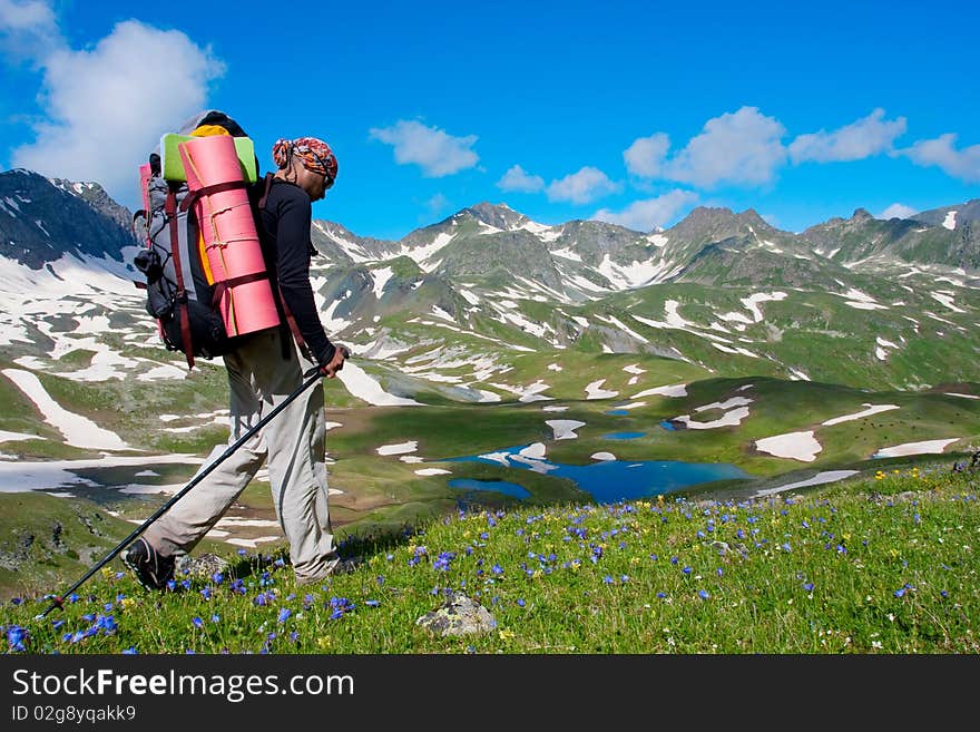 Hiker boy in Caucasus mountains