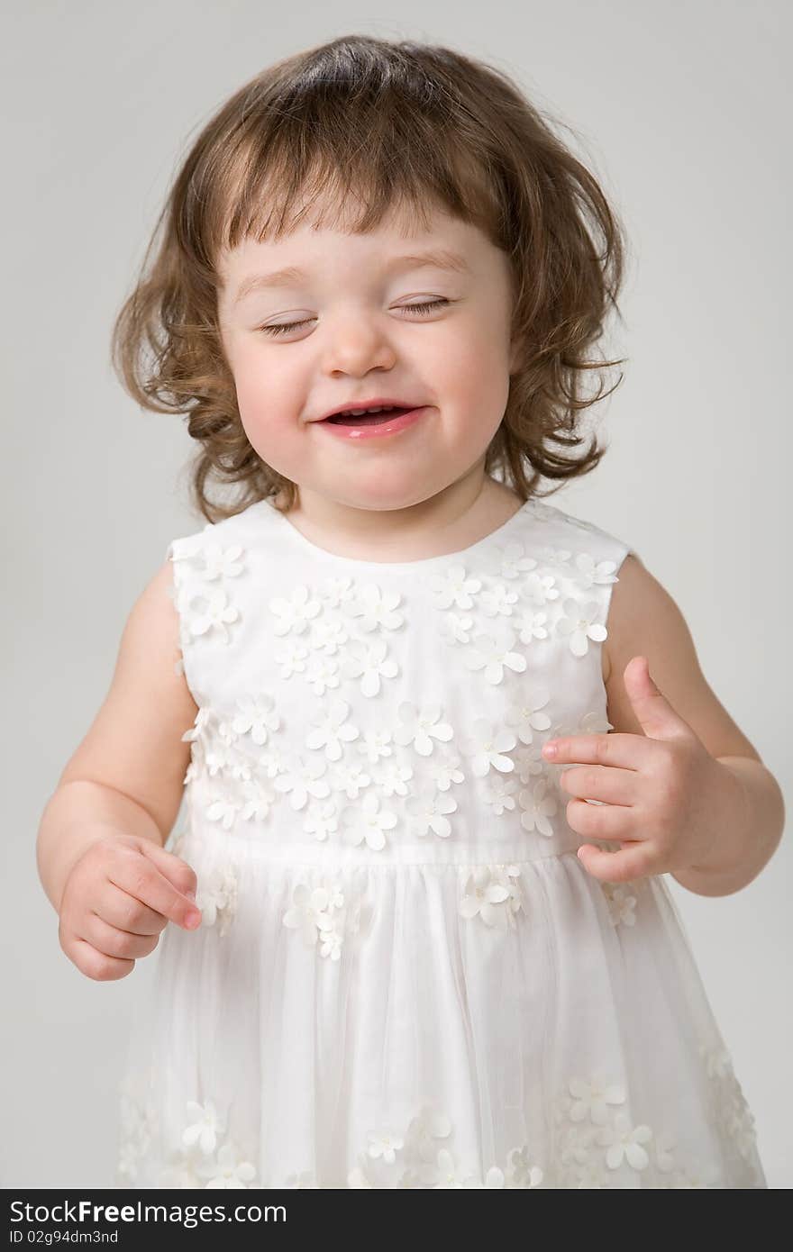 Little girl laughing after she tastes some sweets