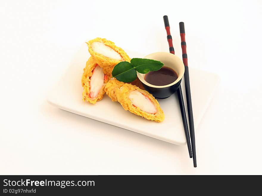 Rolls with white fish on white background