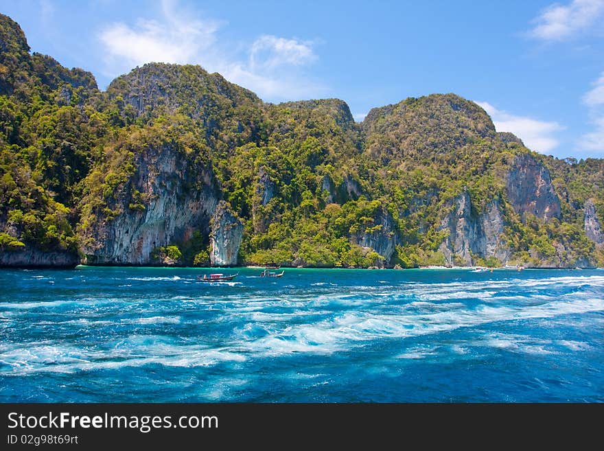 Green cliffs in the sea