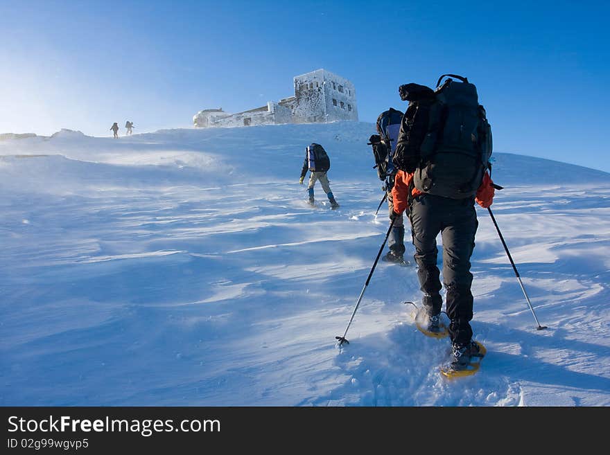 Hiker in winter in mountains