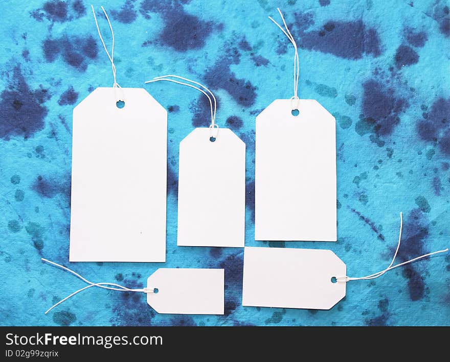 White tags on blue background