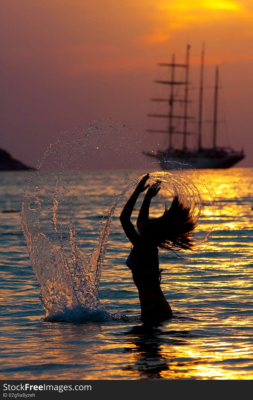 Girl with long hair playing in the sea. Girl with long hair playing in the sea