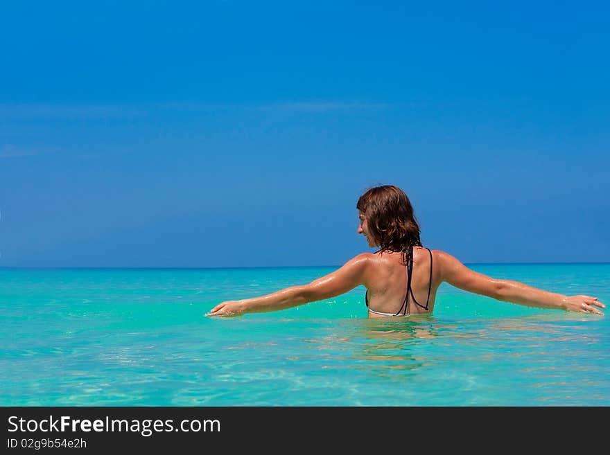 Girl with long hair playing in the sea. Girl with long hair playing in the sea