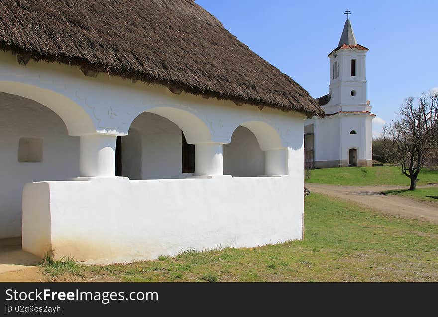 A country house porch and the church.