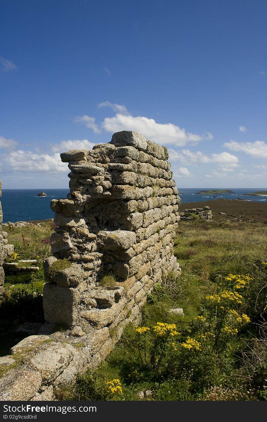 A ruin wall near the Daymark looking out from St Martins Isle of Scilly Cornwall England. A ruin wall near the Daymark looking out from St Martins Isle of Scilly Cornwall England.