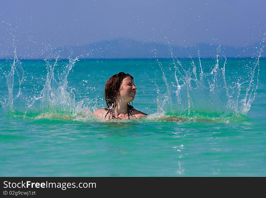 Girl with long hair playing in the sea. Girl with long hair playing in the sea