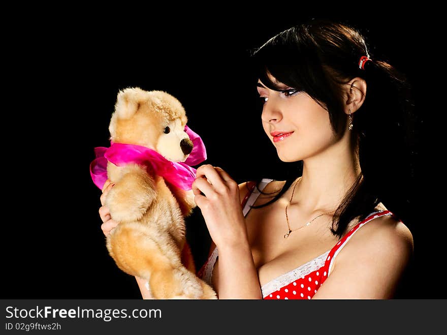 Girl with plush bear.