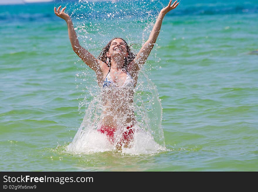 Girl with long hair playing in the sea. Girl with long hair playing in the sea